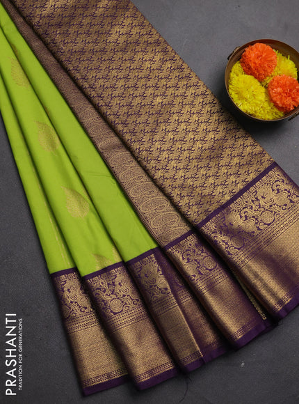Semi kanchipuram silk saree light green and purple with zari woven buttas and zari woven korvai border
