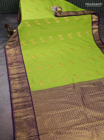 Semi kanchipuram silk saree light green and purple with zari woven buttas and zari woven korvai border