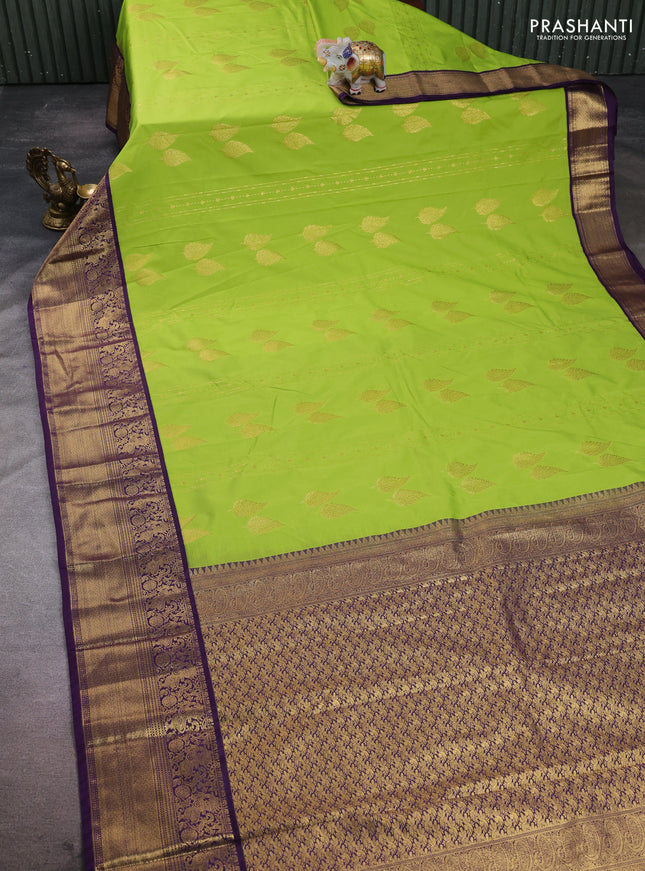 Semi kanchipuram silk saree light green and purple with zari woven buttas and zari woven korvai border