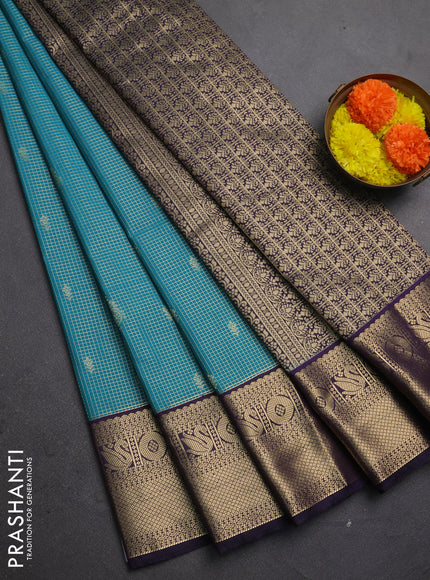 Semi kanchipuram silk saree teal green and deep purple with allover zari checks & buttas and zari woven korvai border