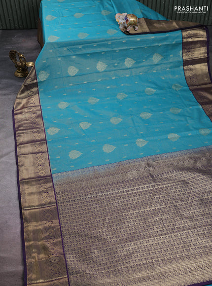 Semi kanchipuram silk saree teal green and deep purple with allover zari checks & buttas and zari woven korvai border