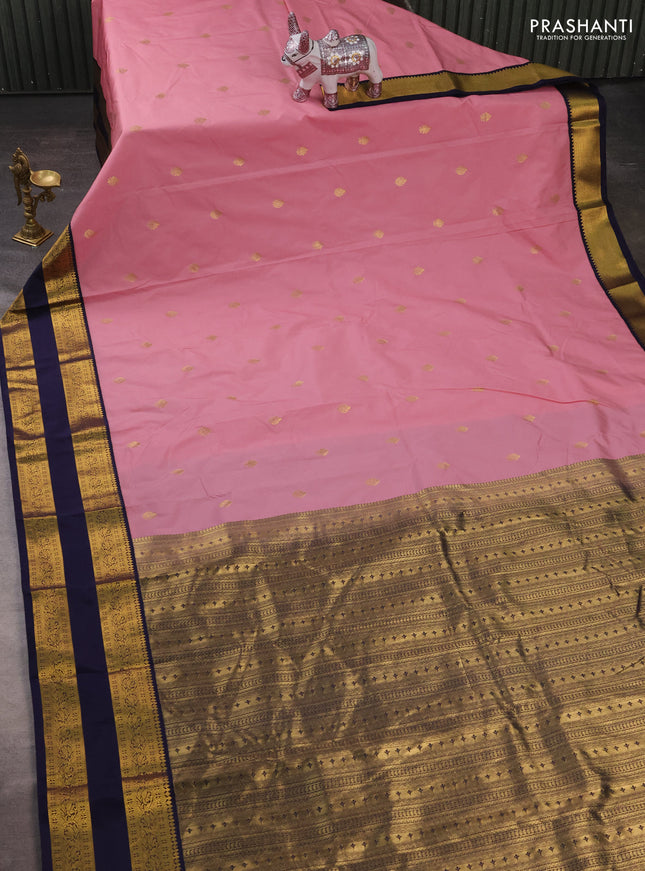 Semi kanchipuram silk saree pastel pink and navy blue with zari woven buttas and rettapet zari woven korvai border