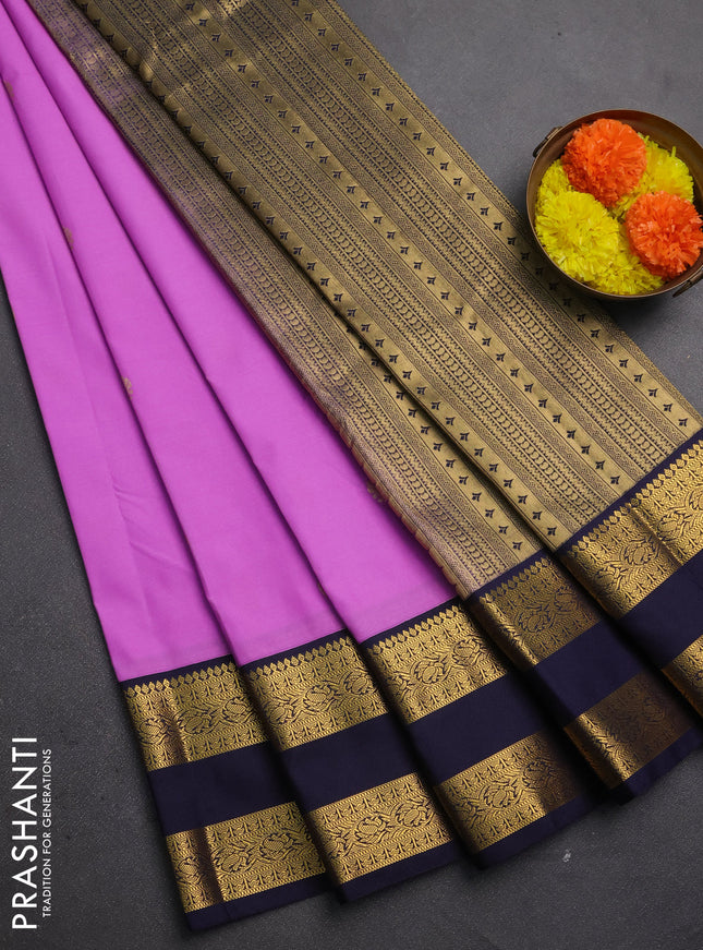 Semi kanchipuram silk saree lotus pink and navy blue with zari woven buttas and rettapet zari woven korvai border