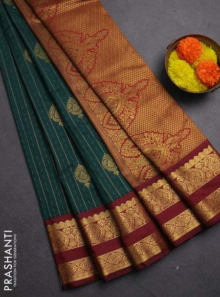 Semi kanchipuram silk saree peacock green and deep maroon with allover zari stripes & buttas and rettapet zari woven korvai border