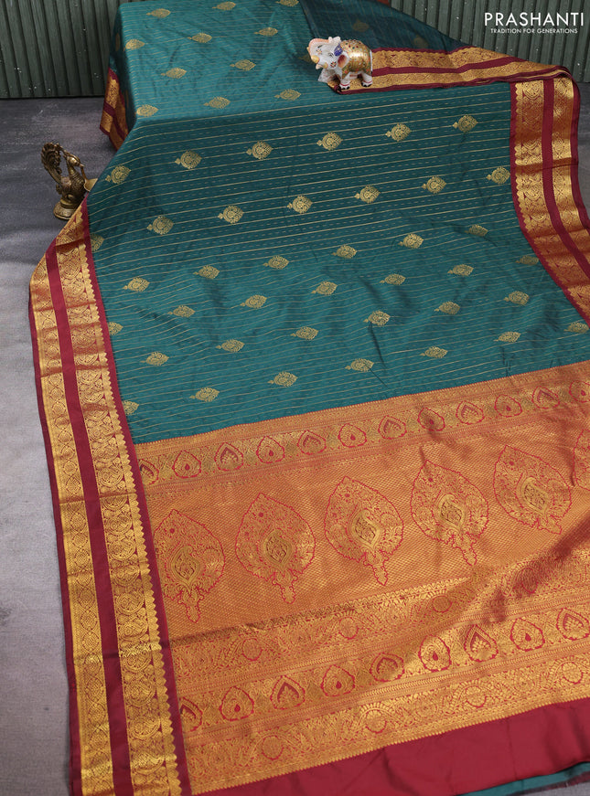 Semi kanchipuram silk saree peacock green and deep maroon with allover zari stripes & buttas and rettapet zari woven korvai border