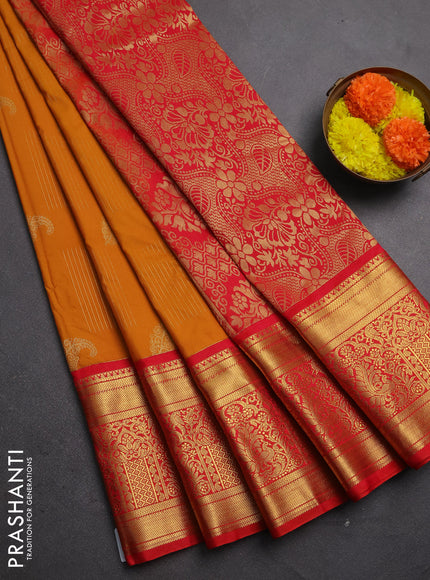 Semi kanchipuram silk saree dark mustard and red with allover zari weaves & buttas and long rich zari woven korvai border
