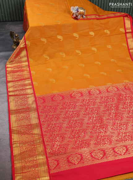 Semi kanchipuram silk saree dark mustard and red with allover zari weaves & buttas and long rich zari woven korvai border