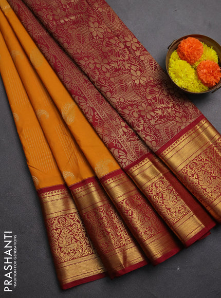 Semi kanchipuram silk saree mustard yellow and maroon with allover zari weaves & buttas and long rich zari woven korvai border