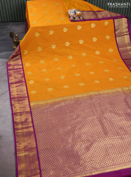 Semi kanchipuram silk saree dark mustard and wine shade with zari woven buttas and rich zari woven korvai border