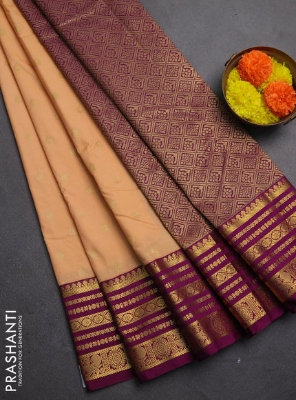 Semi kanchipuram silk saree pale orange and wine shade with allover zari stripes & buttas and long zari woven korvai border