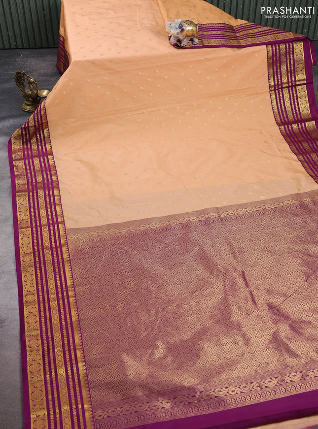 Semi kanchipuram silk saree pale orange and wine shade with allover zari stripes & buttas and long zari woven korvai border