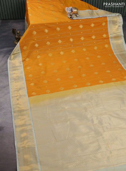 Semi kanchipuram silk saree mustard yellow and mild pista green with allover zari stripes & buttas and zari woven korvai border