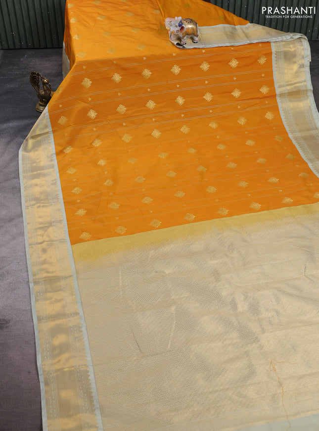 Semi kanchipuram silk saree mustard yellow and mild pista green with allover zari stripes & buttas and zari woven korvai border
