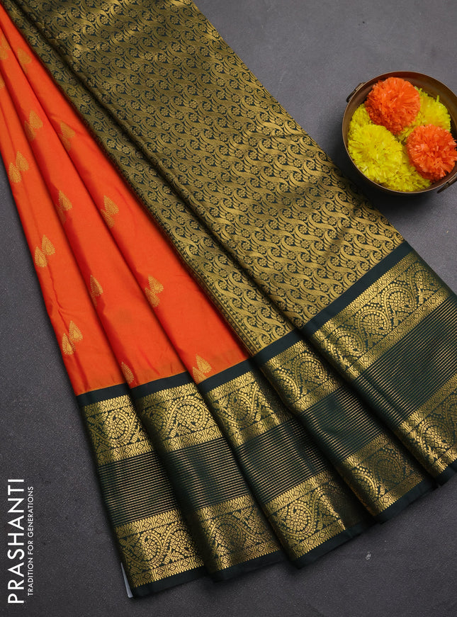 Semi kanchipuram silk saree orange and bottle green with allover zari woven buttas and long zari woven korvai border