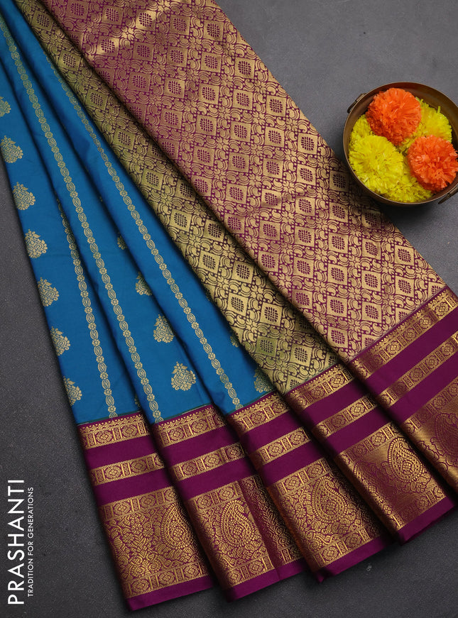Semi kanchipuram silk saree peacock blue and wine shade with allover zari weaves & buttas and long zari woven korvai border