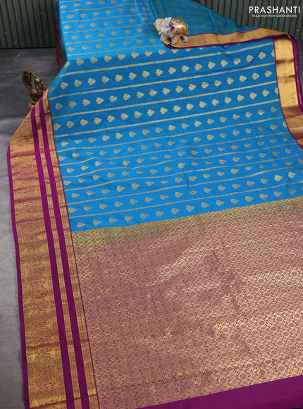 Semi kanchipuram silk saree peacock blue and wine shade with allover zari weaves & buttas and long zari woven korvai border