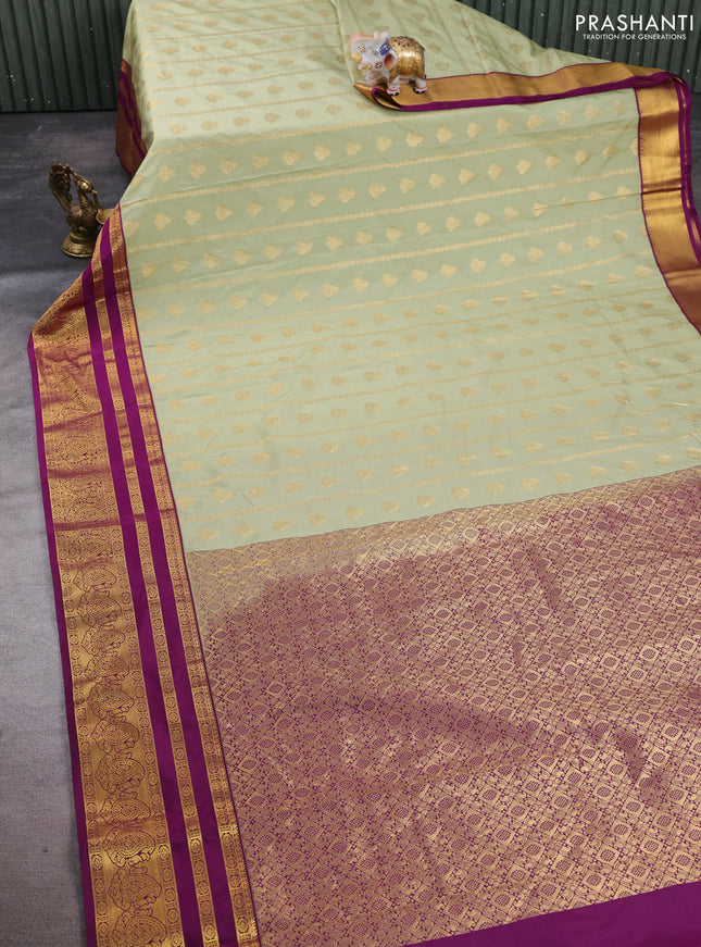 Semi kanchipuram silk saree mild pista green and wine shade with allover zari weaves & buttas and long zari woven korvai border