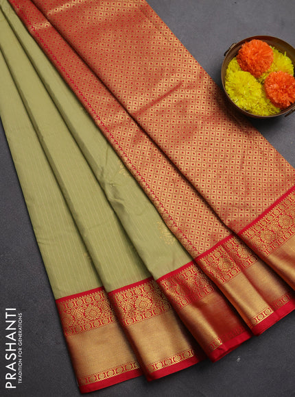 Semi kanchipuram silk saree mild pista green and red with allover zari stripes & buttas and rich zari woven korvai border
