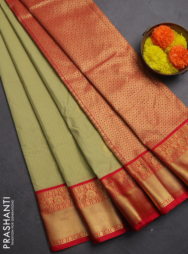 Semi kanchipuram silk saree mild pista green and red with allover zari stripes & buttas and rich zari woven korvai border
