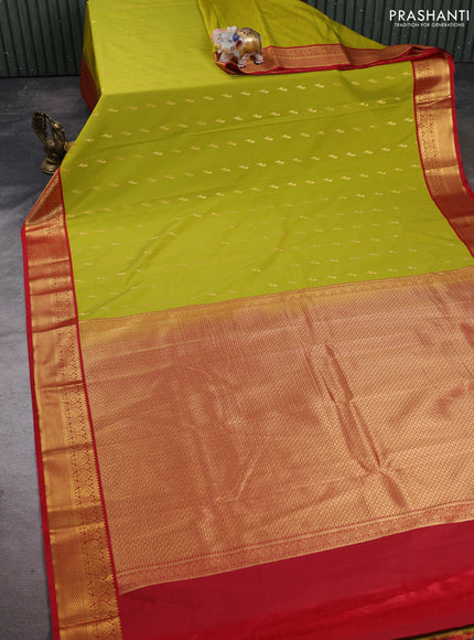 Semi kanchipuram silk saree lime green and red with allover zari woven buttas and zari woven korvai border