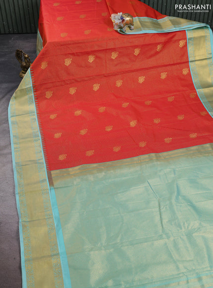 Semi kanchipuram silk saree orange and teal shade with allover small zari checks & buttas and temple design zari woven korvai border