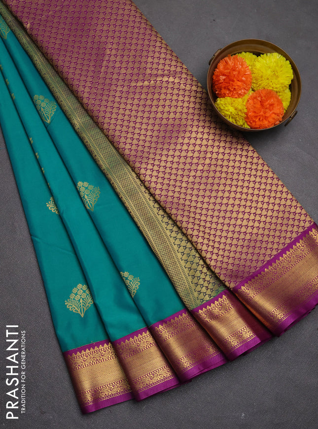 Semi kanchipuram silk saree teal green and purple with allover zari woven buttas and zari woven korvai border