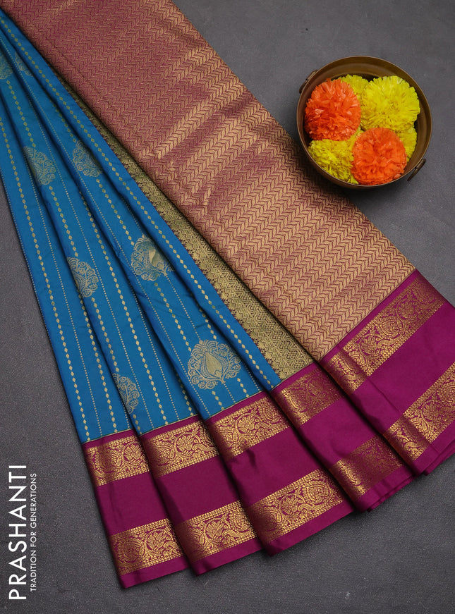 Semi kanchipuram silk saree dual shade of bluish green and magenta pink with allover zari stripe & buttas and rettapet zari woven border