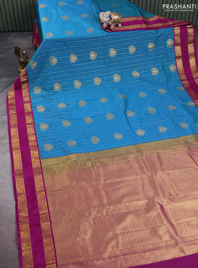 Semi kanchipuram silk saree dual shade of bluish green and magenta pink with allover zari stripe & buttas and rettapet zari woven border