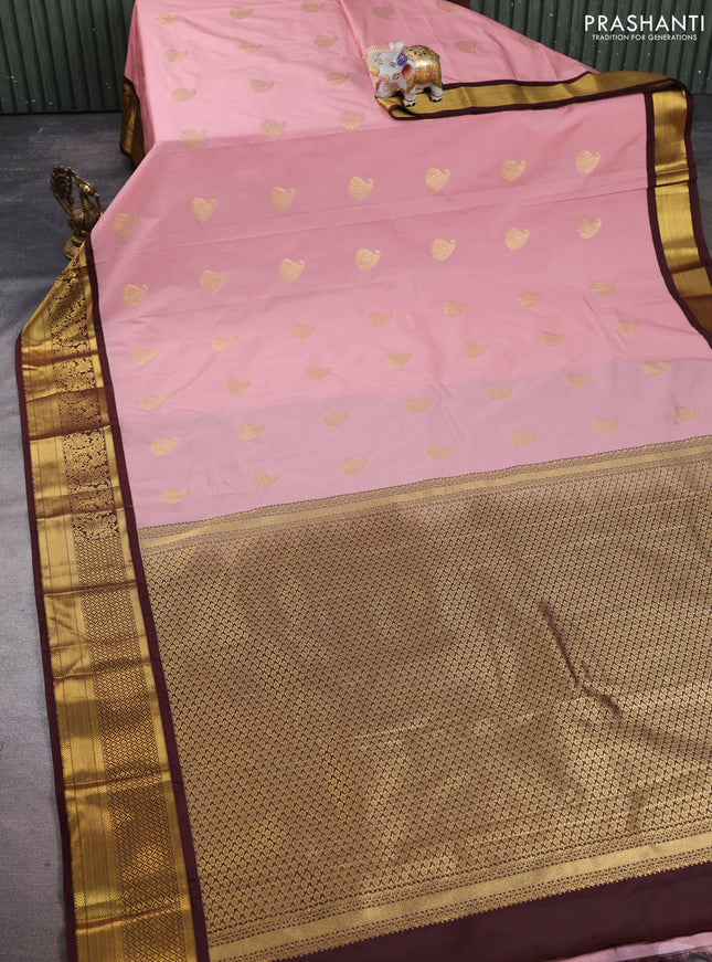 Semi kanchipuram silk saree pastel pink and deep maroon with paisley zari woven buttas and zari woven korvai border