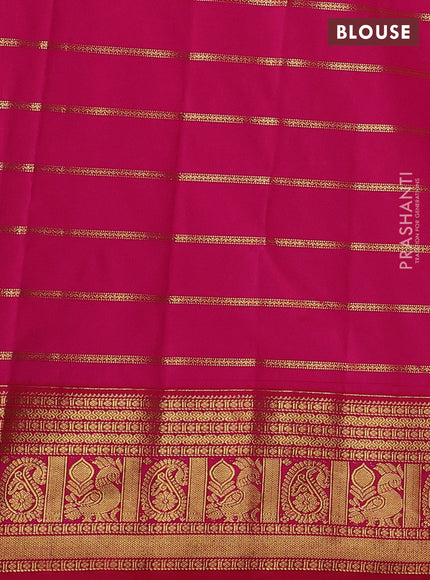 Semi kanchipuram silk saree dark mustard and pink with allover zari weaves and zari woven korvai border