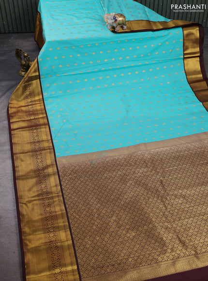 Semi kanchipuram silk saree teal green and coffee brown with allover zari woven buttas and long zari woven korvai border