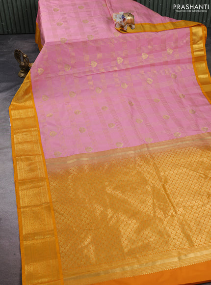 Semi kanchipuram silk saree light pink and mustard yellow with allover zari checks & buttas and zari woven korvai border