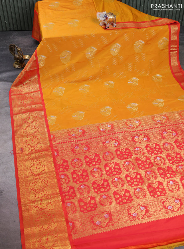 Semi kanchipuram silk saree dark mustard and orange with allover zari weaves & buttas and long zari woven korvai border