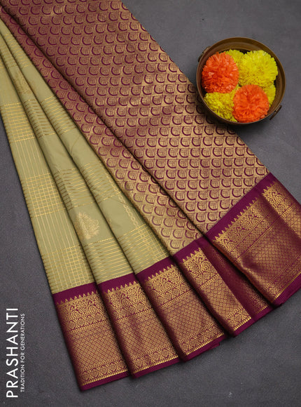 Semi kanchipuram silk saree mild pista green and magenta pink with allover zari checks & buttas and zari woven border