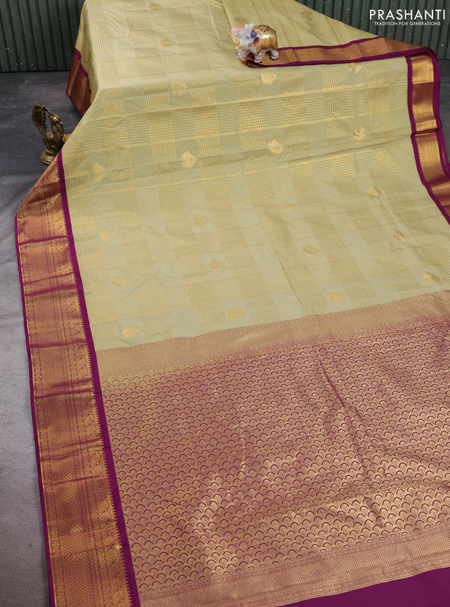 Semi kanchipuram silk saree mild pista green and magenta pink with allover zari checks & buttas and zari woven border