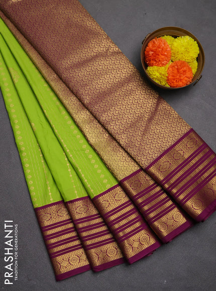 Semi kanchipuram silk saree light green and magenta pink with allover zari weaves & buttas and zari woven border