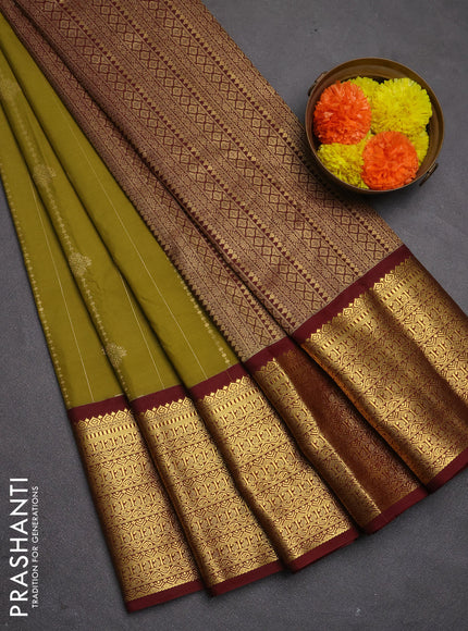 Semi kanchipuram silk saree mustard green and maroon with allover zari weaves and long zari woven korvai border