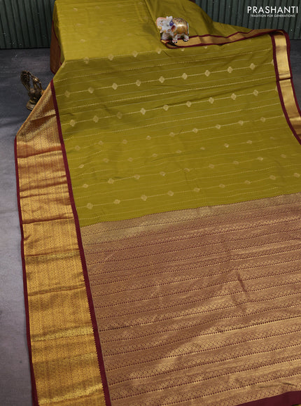Semi kanchipuram silk saree mustard green and maroon with allover zari weaves and long zari woven korvai border