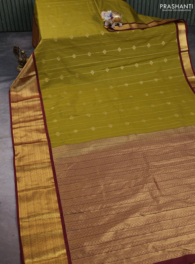 Semi kanchipuram silk saree mustard green and maroon with allover zari weaves and long zari woven korvai border