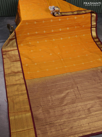 Semi kanchipuram silk saree mustard yellow and maroon with allover zari weaves and zari woven korvai border