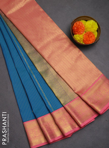 Semi kanchipuram silk saree teal blue and peach pink with allover zari weaves and zari woven korvai border
