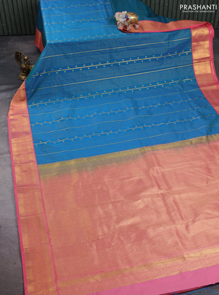 Semi kanchipuram silk saree teal blue and peach pink with allover zari weaves and zari woven korvai border