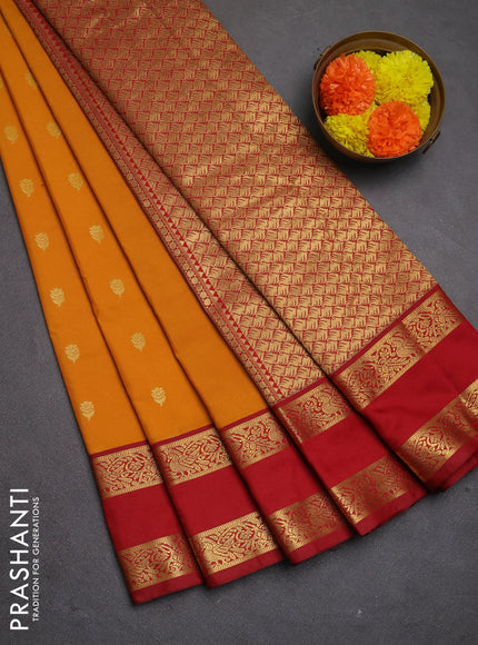 Semi kanchipuram silk saree sunset orange and maroon with allover zari woven buttas and rettapet zari woven korvai border