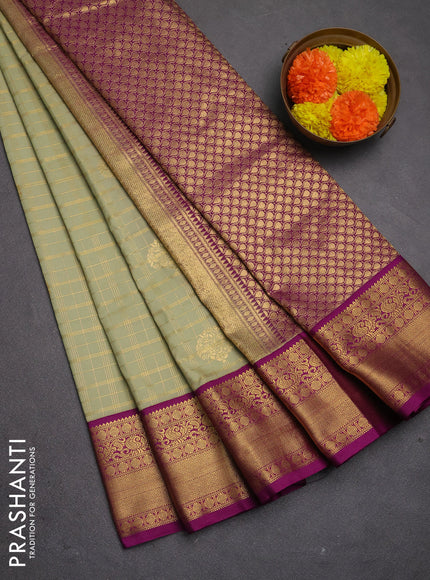 Semi kanchipuram silk saree mild pista green and purple with allover zari checks & buttas and zari woven korvai border