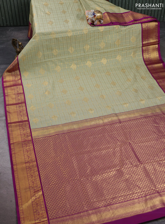 Semi kanchipuram silk saree mild pista green and purple with allover zari checks & buttas and zari woven korvai border