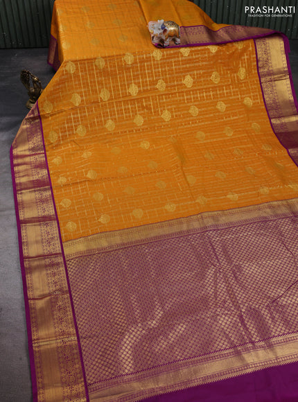 Semi kanchipuram silk saree dark mustard and purple with allover zari checks & buttas and zari woven korvai border