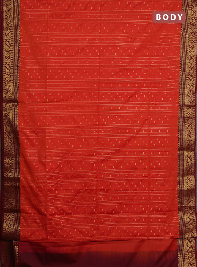Semi soft silk saree orange and maroon with allover zari weaves and zari woven border