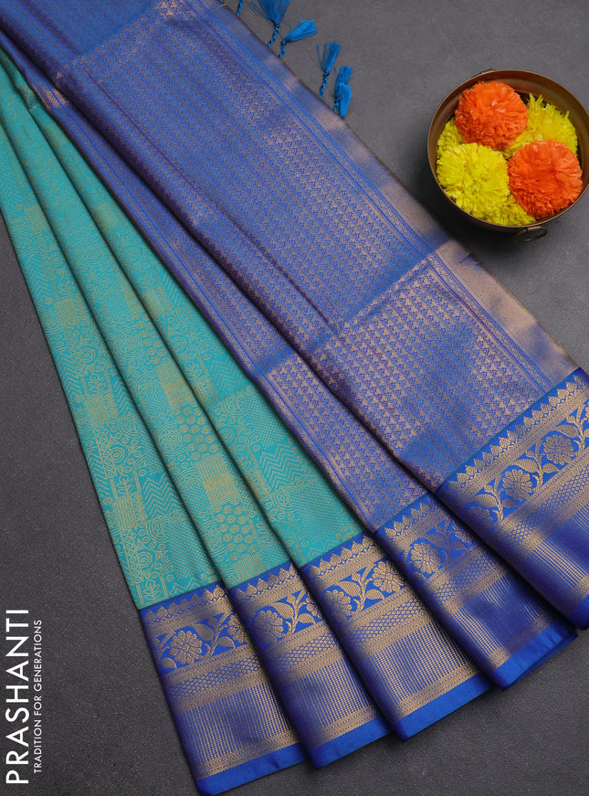 Semi soft silk saree teal green and blue with allover zari weaves and zari woven border