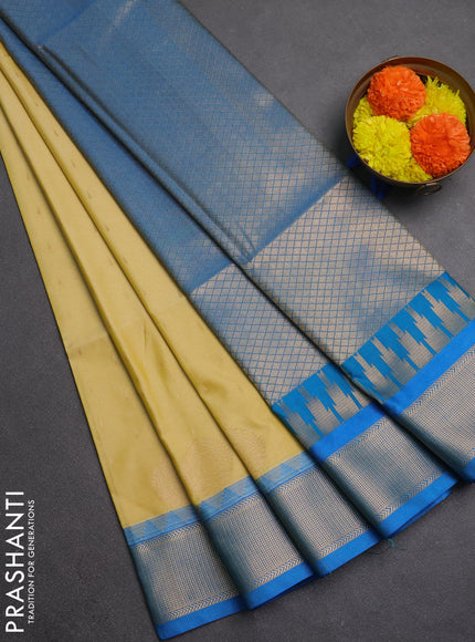 Semi soft silk saree pale yellow and cs blue with allover zari woven buttas and zari woven border