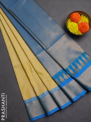 Semi soft silk saree pale yellow and cs blue with allover zari woven buttas and zari woven border